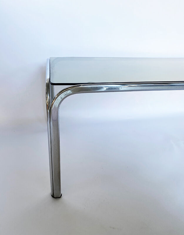 Metal table and smoked glass