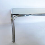 Metal table and smoked glass