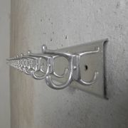 Wall-mounted aluminium coat rack of 225 cm with 16 double hooks, 1960s.