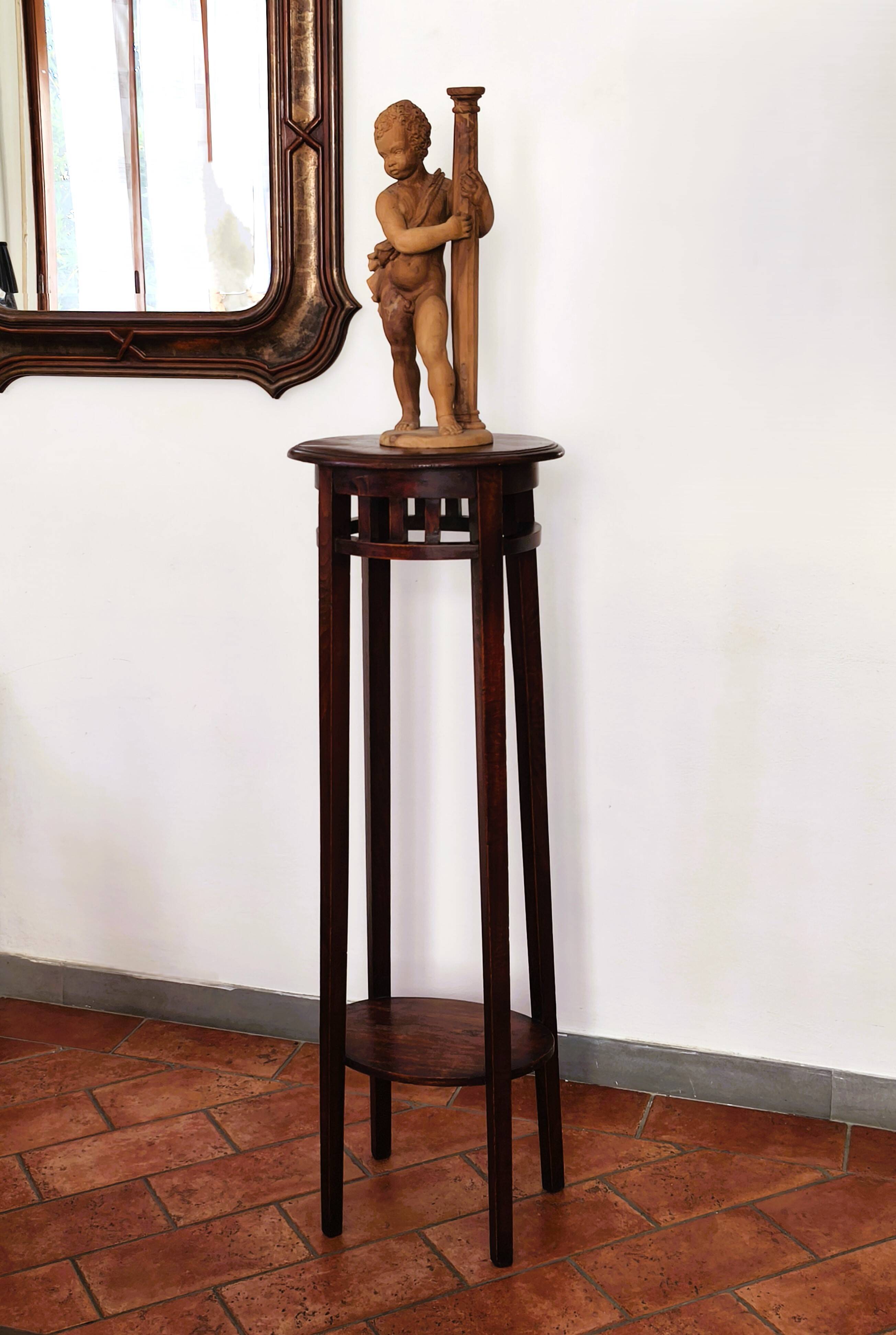 Antique high wooden pedestal with mahogany patina, circa 1900-1925.