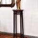 Antique high wooden pedestal with mahogany patina, circa 1900-1925.