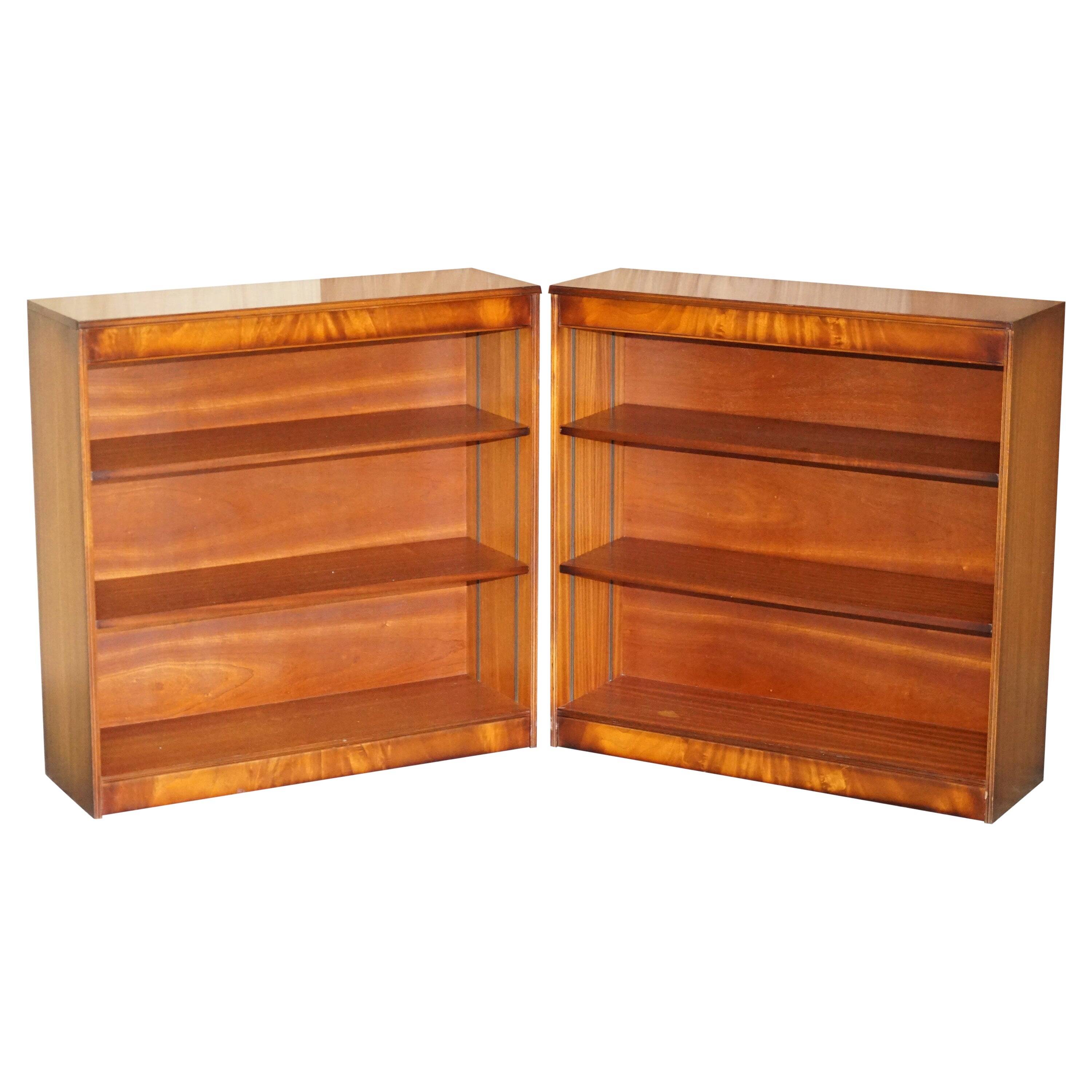 Pair of open dwarf bookshelves in mahogany by Shaws of London.