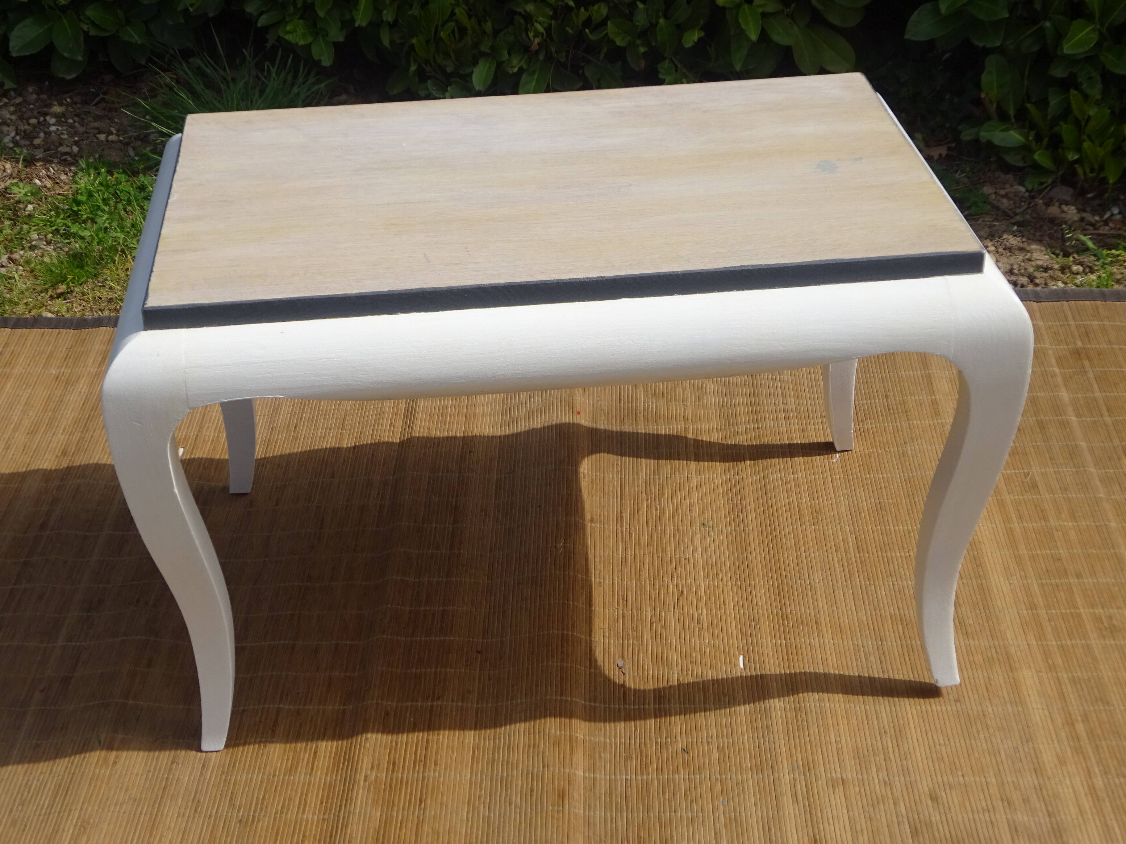 Oak coffee table with curved legs.