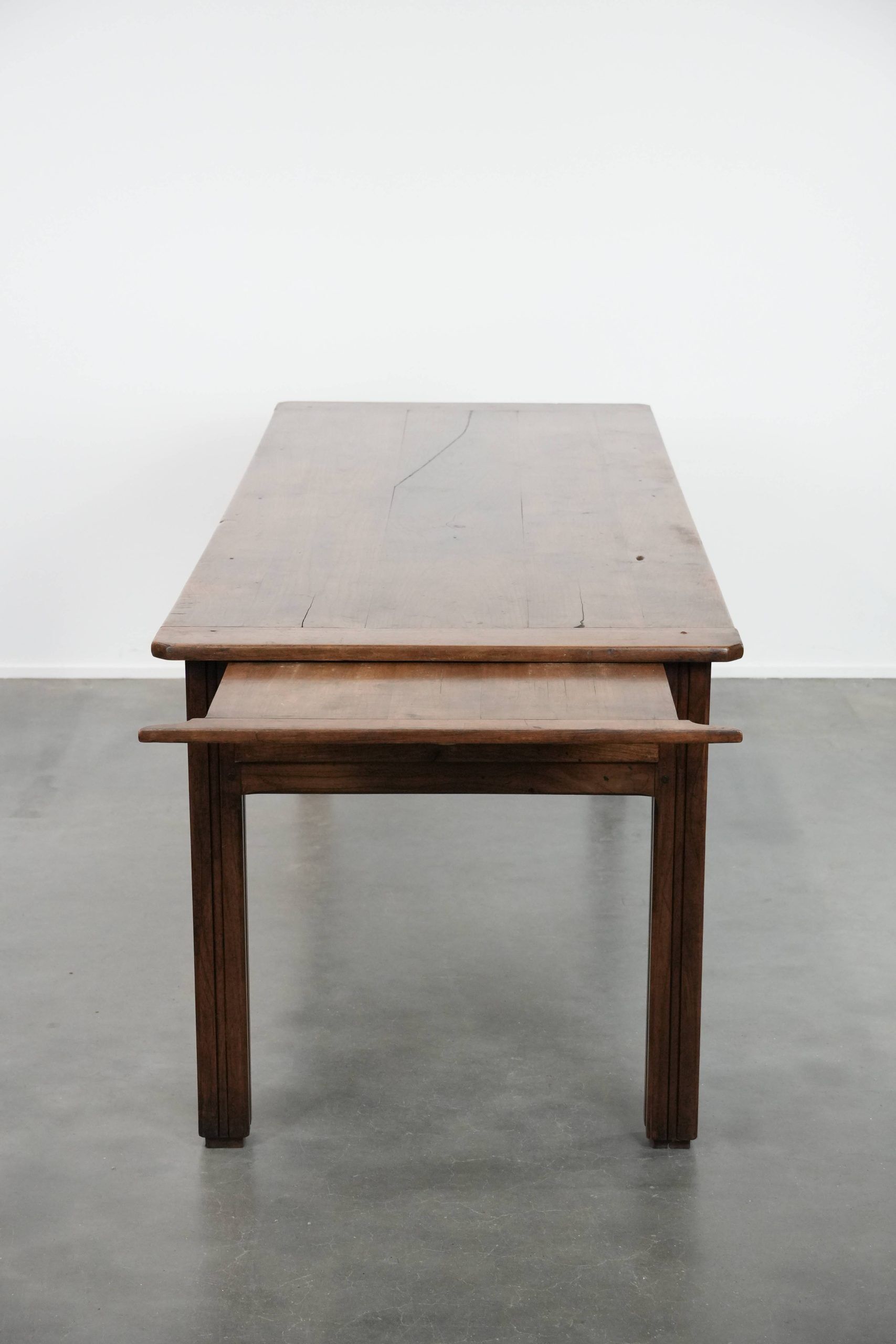 Antique French farmhouse dining table with two drawers and a pull-out board