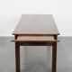 Antique French farmhouse table with two drawers and an extendable leaf.