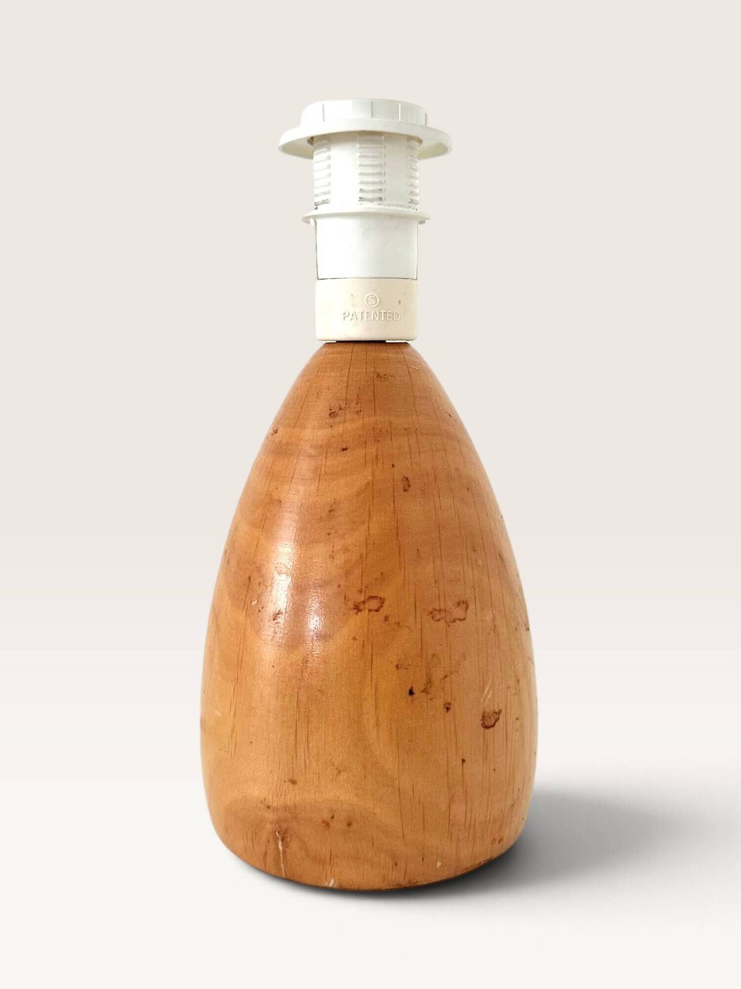 Wood-turned lamp with a hand-drawn lampshade, circus patterns.