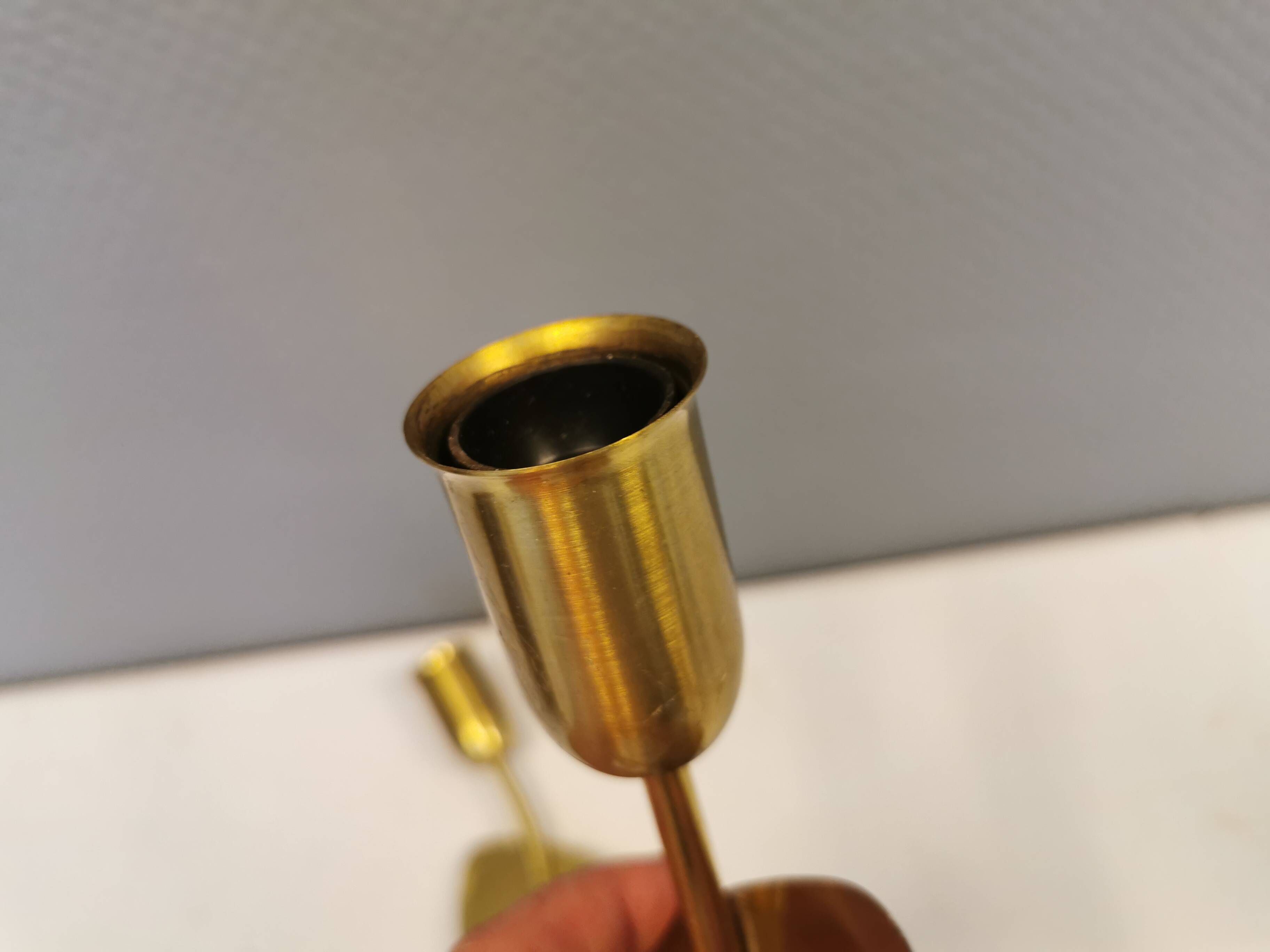 A set of "tulip" wall lamps in golden colored metal. Danish 1970-80s