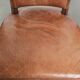 Set of 4 cognac-coloured cowleather dining chairs with decorative nails
