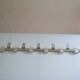 Vintage 70s brushed aluminum metal 12-hook wall coat rack