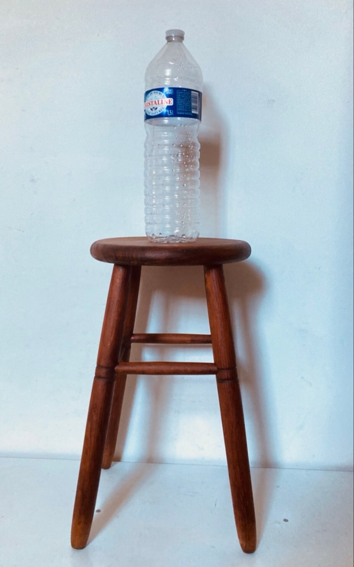 Vintage four-legged stool made of solid wood from the 1970s/80s.