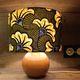 Solid wood ball lamp, lampshade with stylised wax flowers in khaki/yellow.