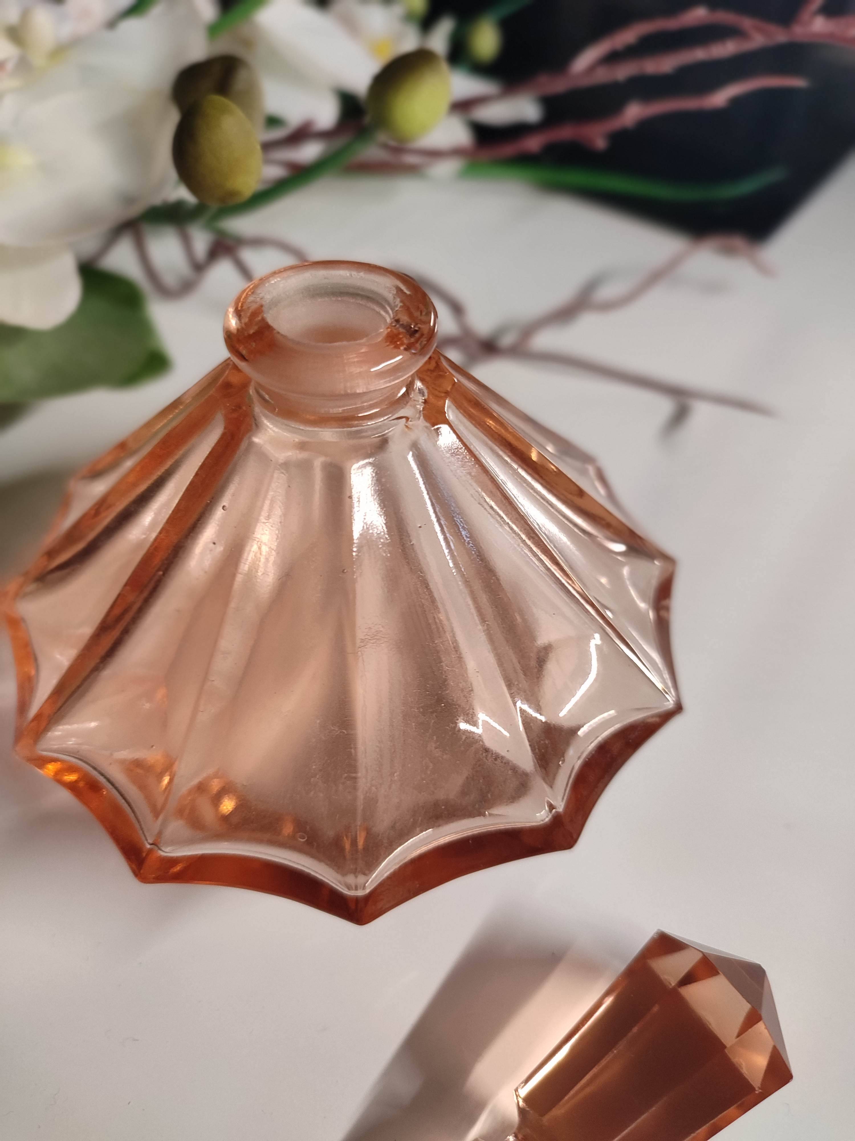 Vintage Art Deco perfume bottle in beautiful pink glass.