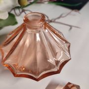 Vintage Art Deco perfume bottle in beautiful pink glass.