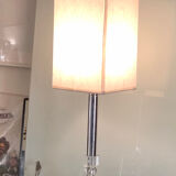Silver floor lamp with a straight shade.