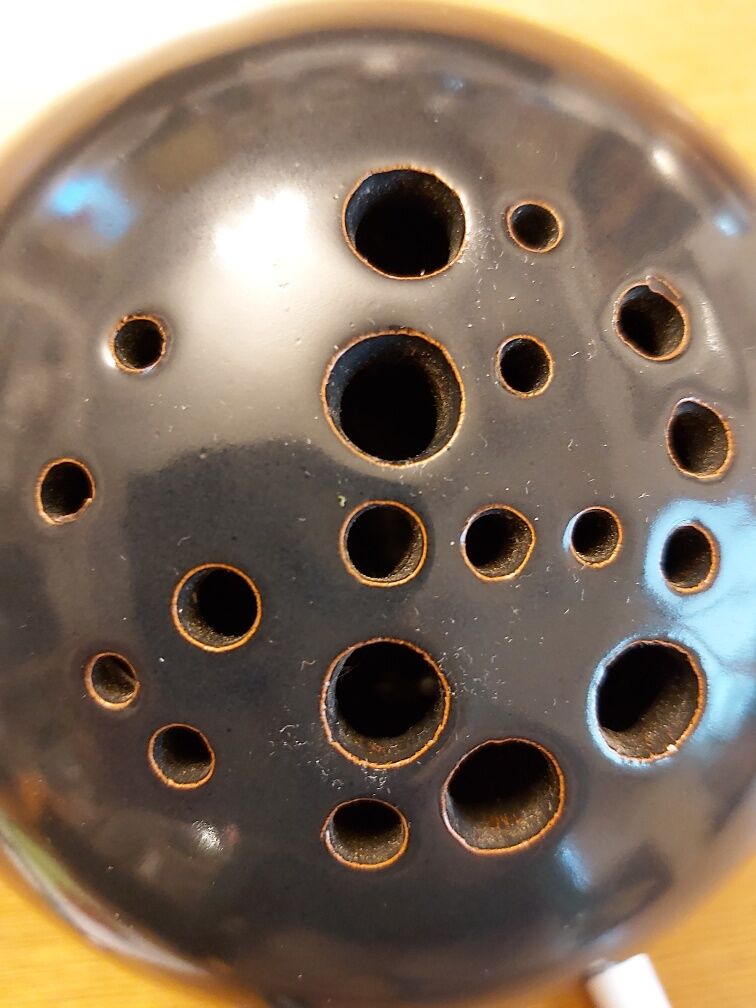 Signed ceramic flower-picker ball