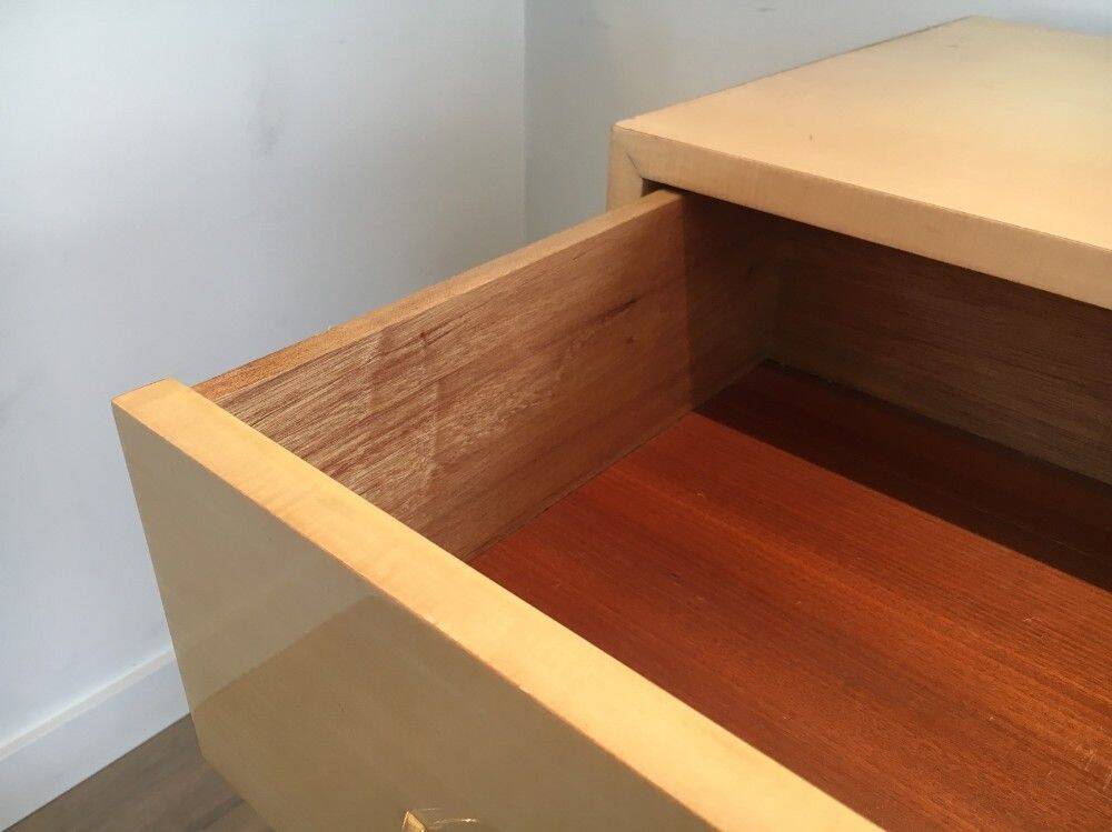 Eggshell lacquered chest of drawers with brushed steel legs. In the style of Knoll.