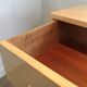 Eggshell lacquered chest of drawers with brushed steel legs. In the style of Knoll.
