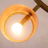 Matte gold brass circular chandelier. Contemporary Italian work.