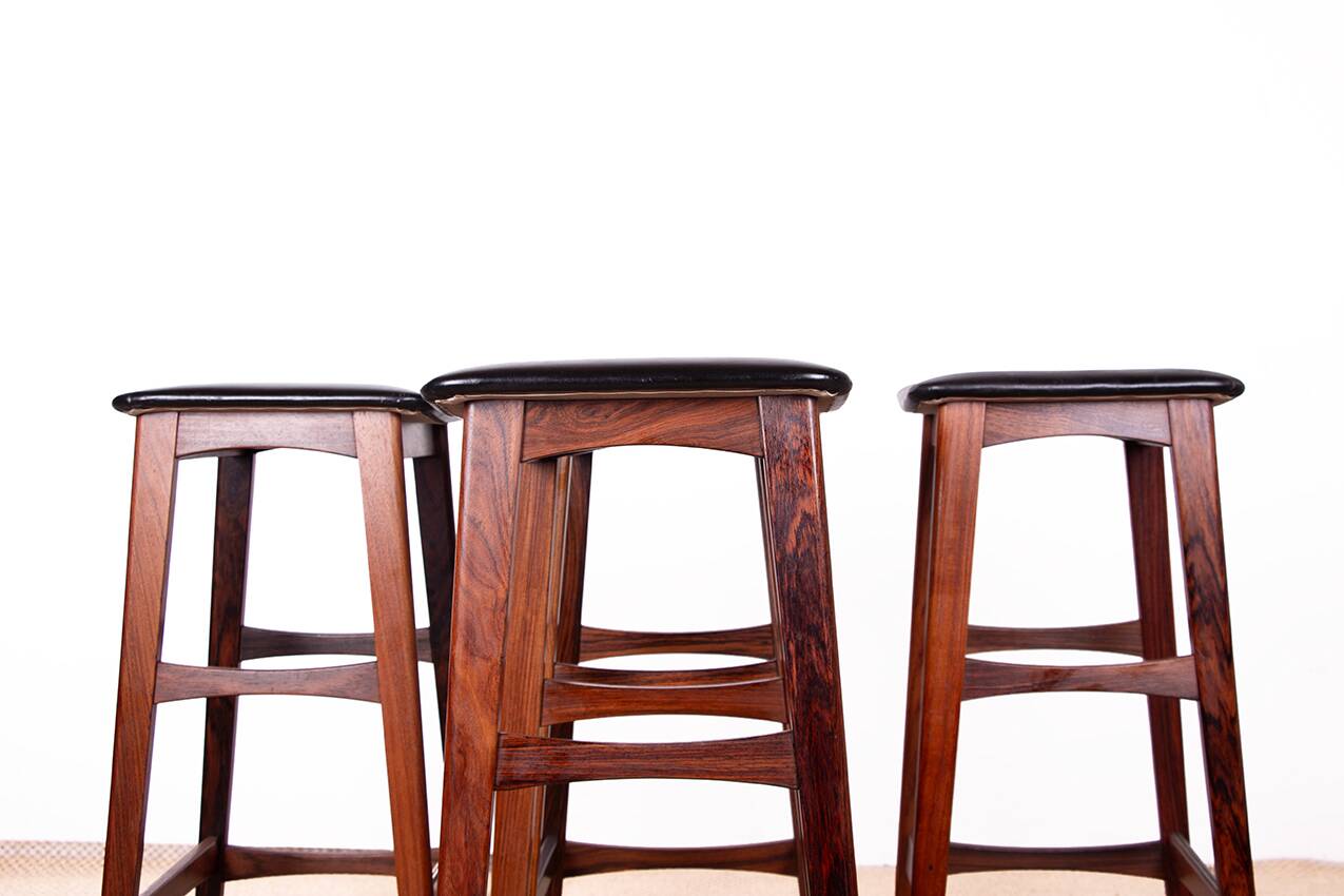 4 Danish high stools, rosewood and black leather, Knud Bent for Dyrlund.