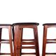 4 Danish high stools, rosewood and black leather, Knud Bent for Dyrlund.