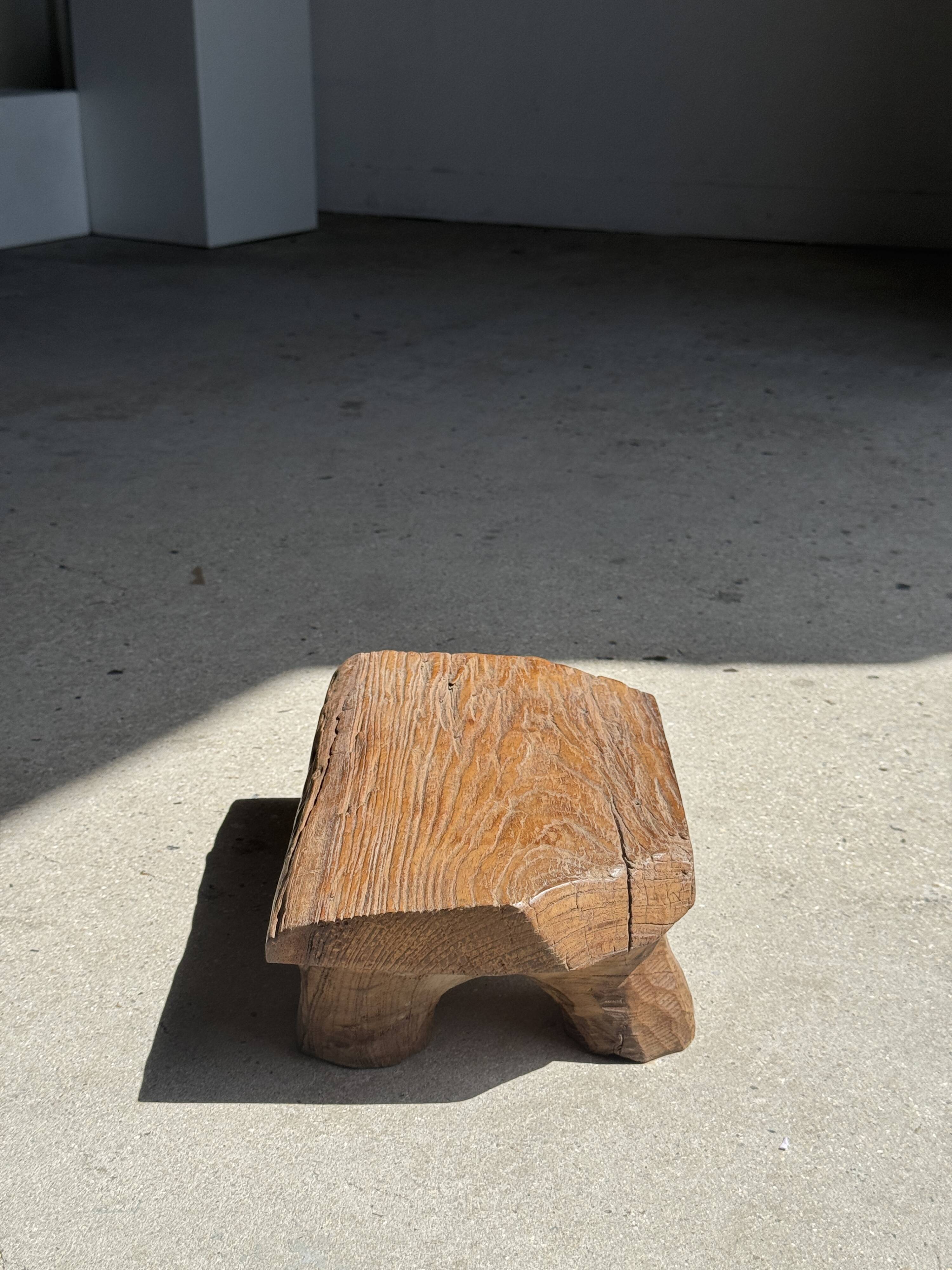Small stool, teak footrest with short cut corners.