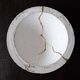 Concrete cup, tinted waxed, inlaid with gold leaf drips in a Kintsugi inspiration