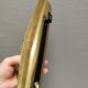 Older wall lamp in brass with hard pressed glass shade.