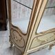 Louis XV / Rococo style display cabinet, painted wood in cream and gold tones.