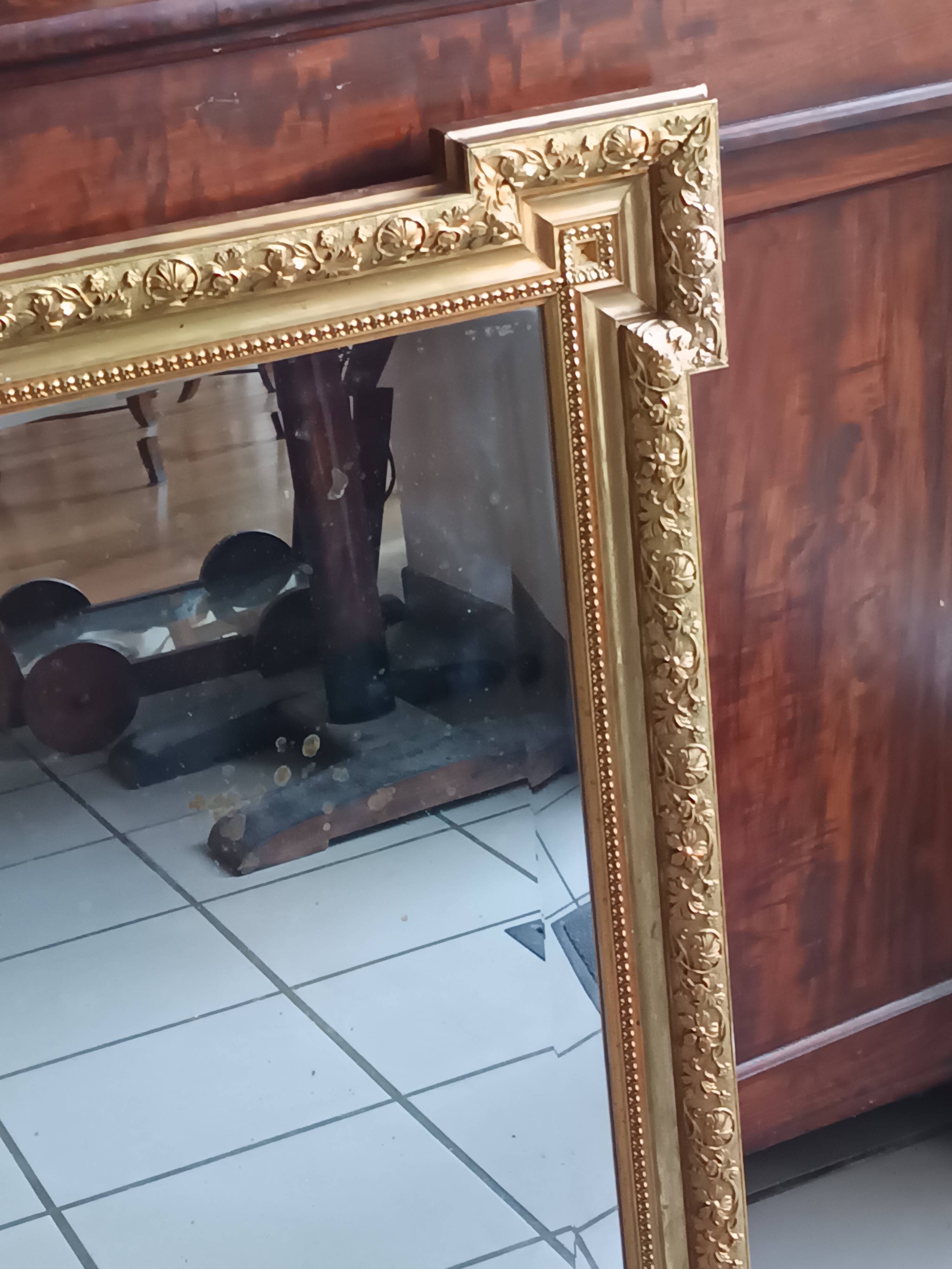 Antique mirror in wood and gilded stucco, neo Louis XVI style.