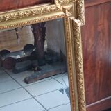 Antique mirror in wood and gilded stucco, neo Louis XVI style.