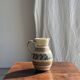 Beige carafe with stylized blue flower friezes