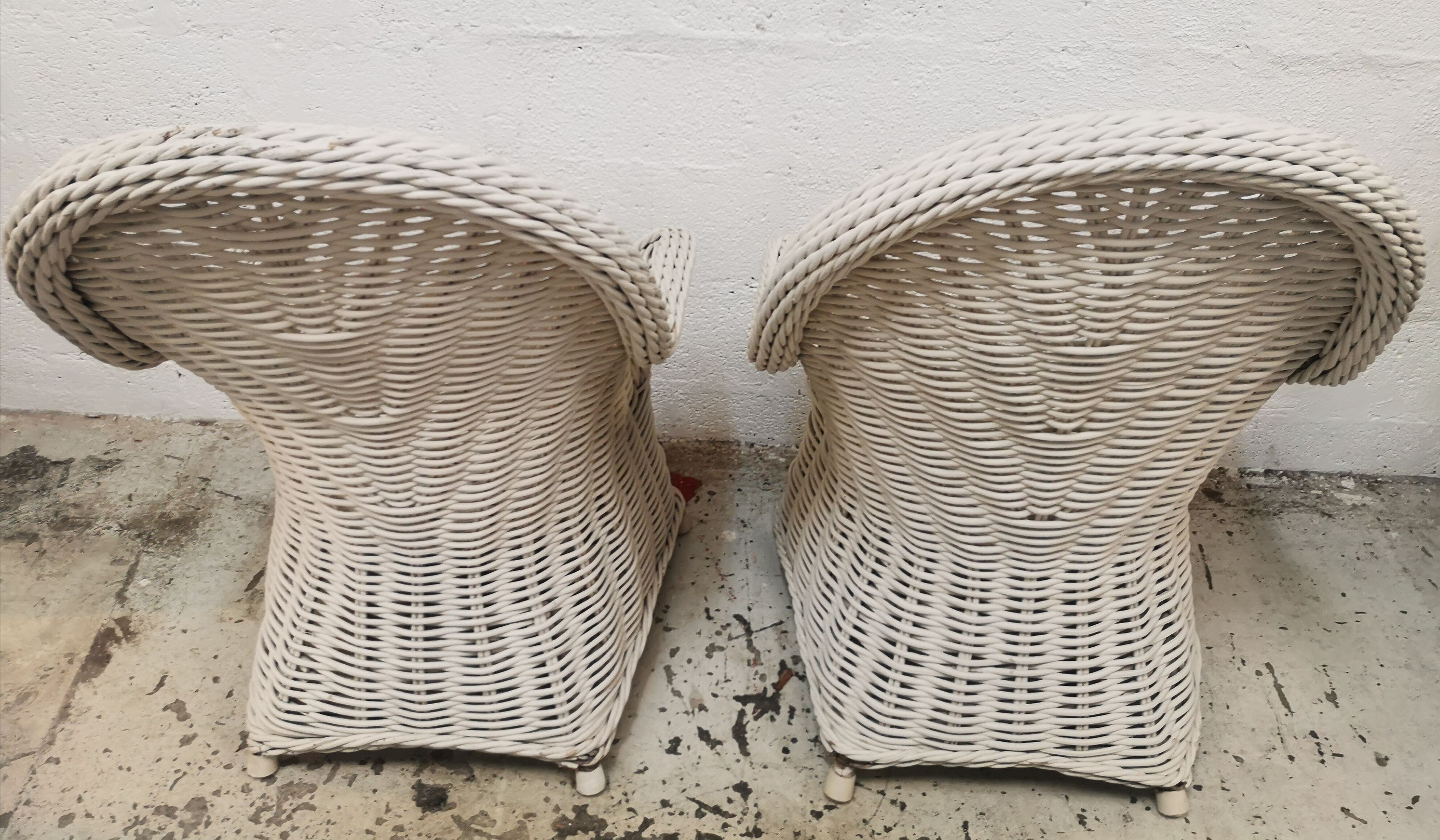 Pair of white rattan armchairs