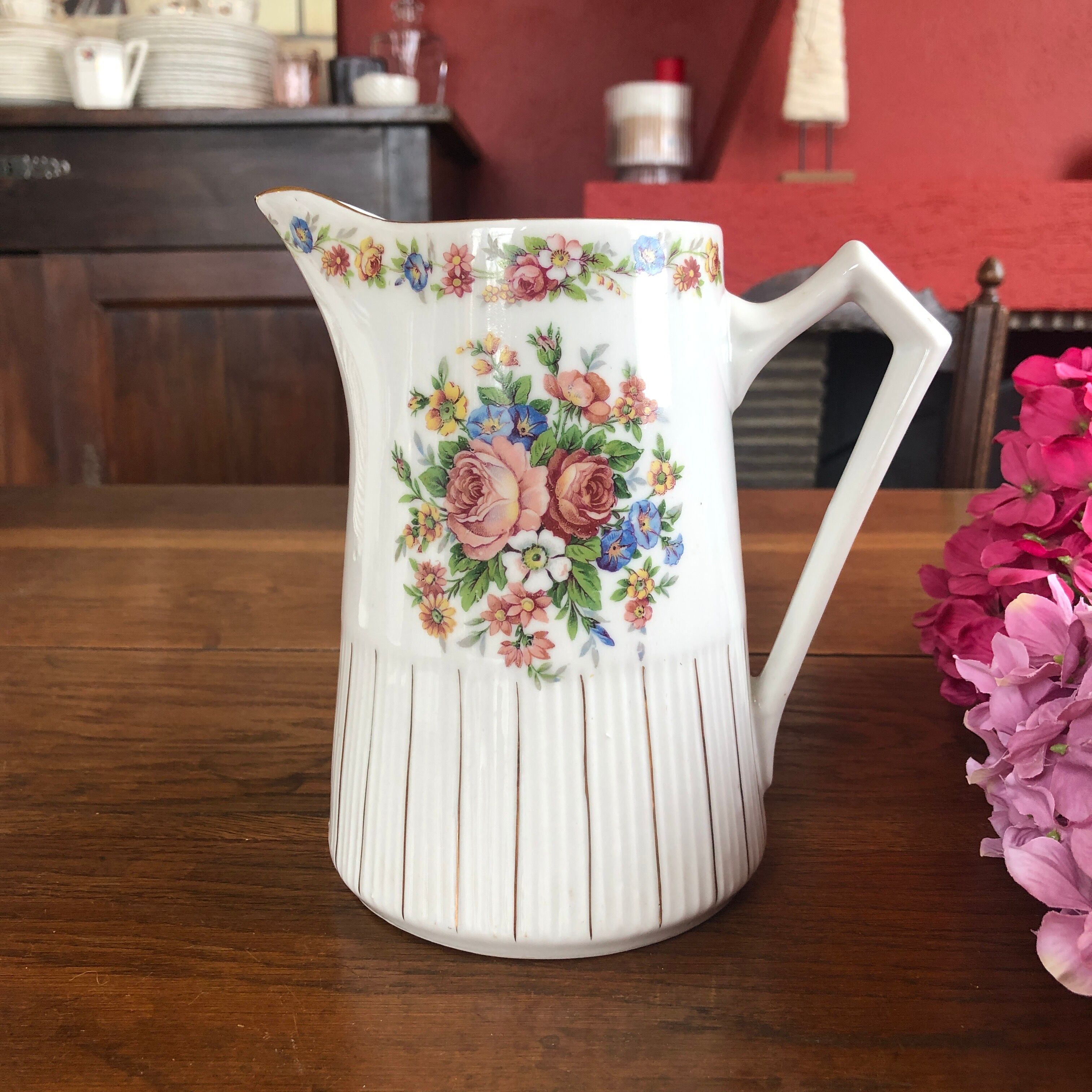 Porcelain pitcher with flowers