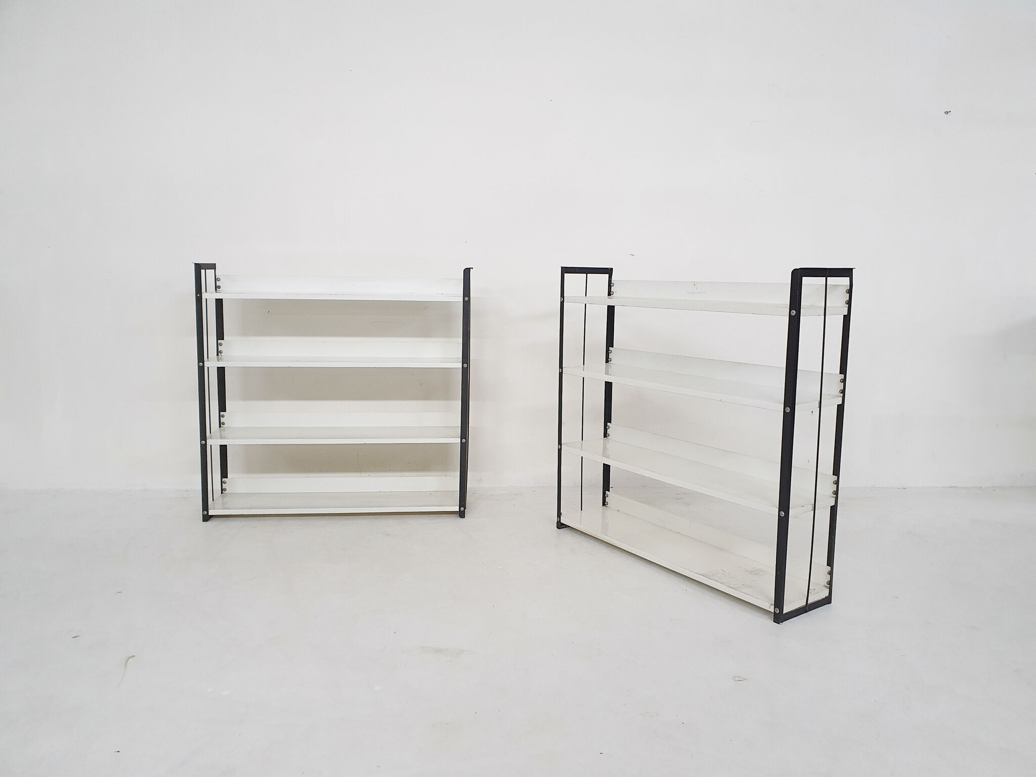 Set of two black and white metal book shelves attrb. to Tomado, Holland, 1950's