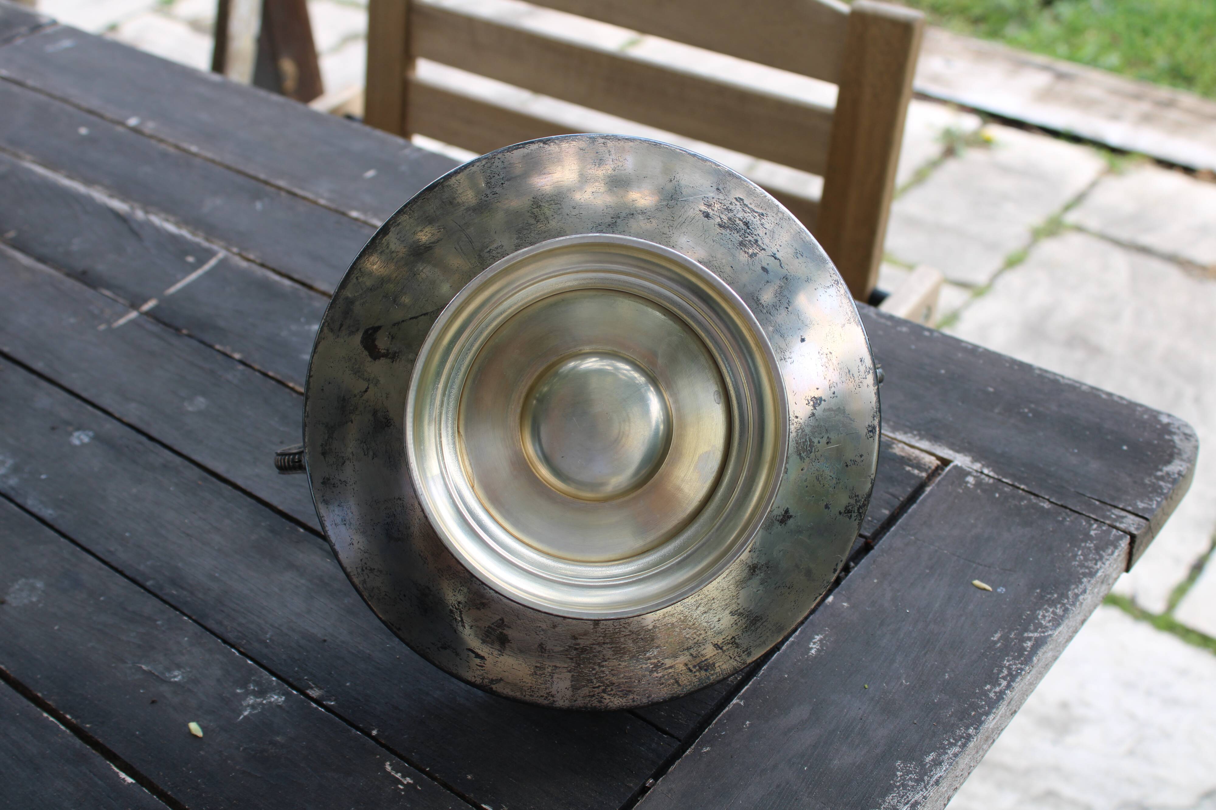 Worked metal fruit basket and glass