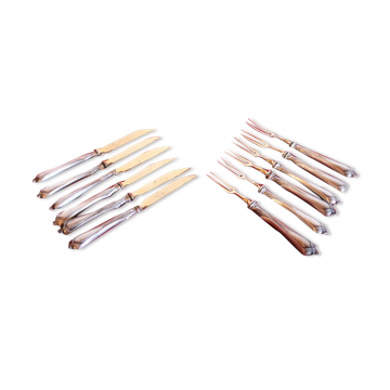 Set of knives and forks for fruits.