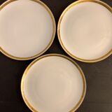 7 flat plates in porcelain of Limoges Bernardaud, decoration of golden Greek, XXth century