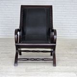 1970s, vintage armchair with footstool, black furniture leather.