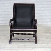 1970s, vintage armchair with footstool, black furniture leather.