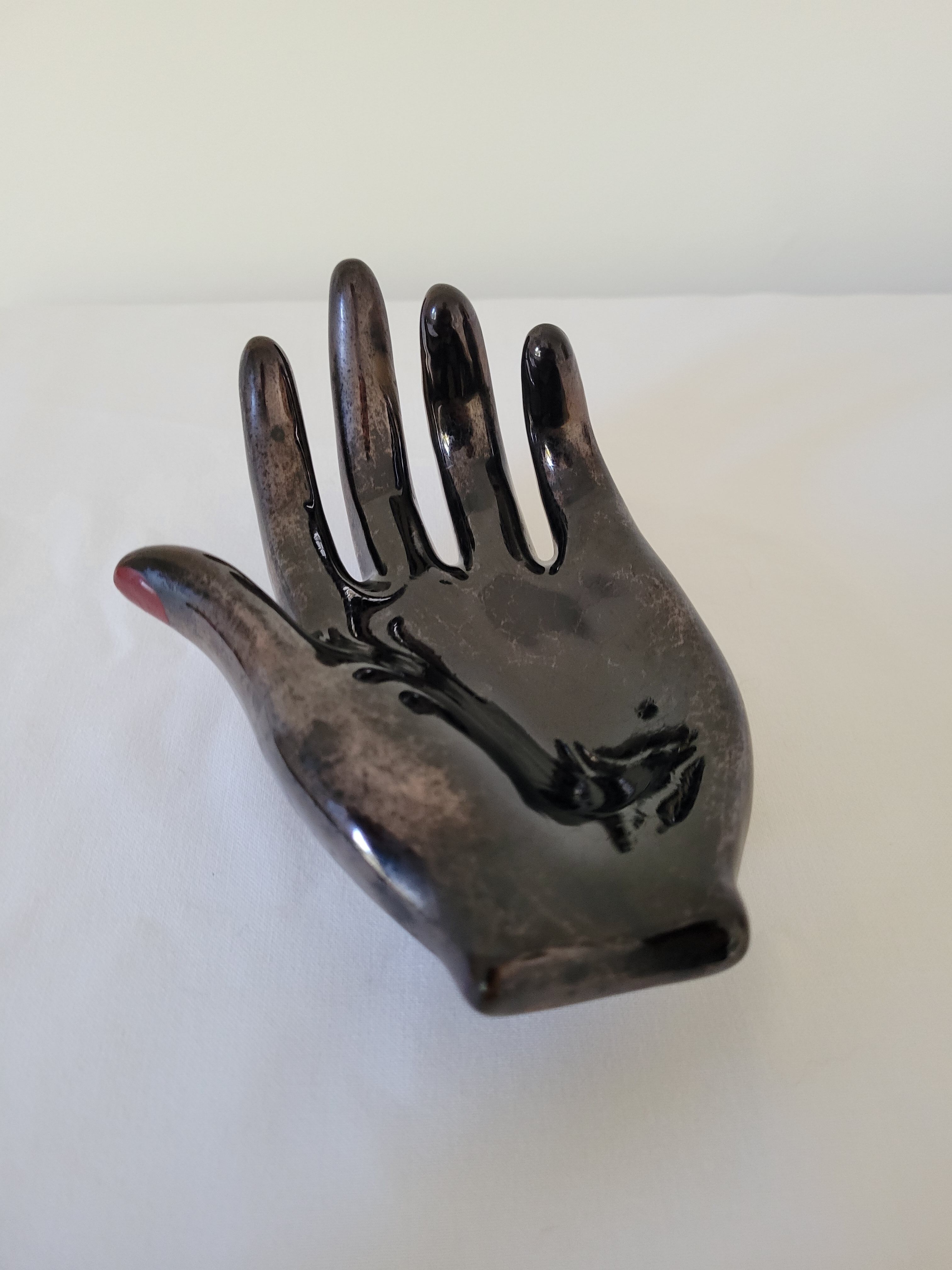 Empty pockets in the shape of a hand