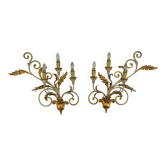 Pair of large floral wall lamps in gilded and lacquered metal. Italy 1960s