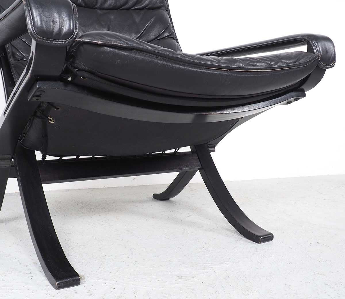 Westnofa black leather Flex armchair with ottoman