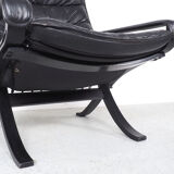 Westnofa black leather Flex armchair with ottoman