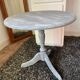 Patinated wooden pedestal table
