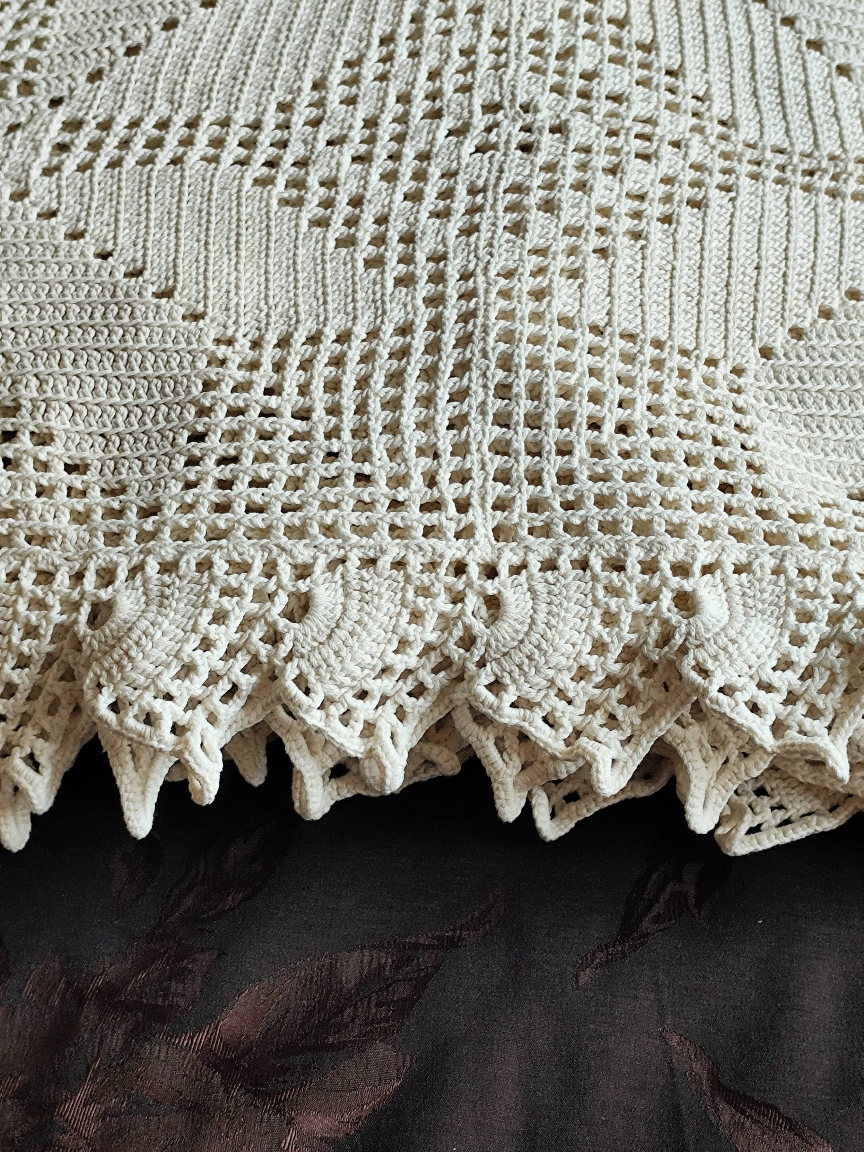 White cotton bedspread, crocheted sofa throw with star patterns