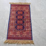 Tapis d’Orient bleu rouge avec franges