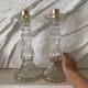Paire de bougeoirs en verre flacons roger gallet