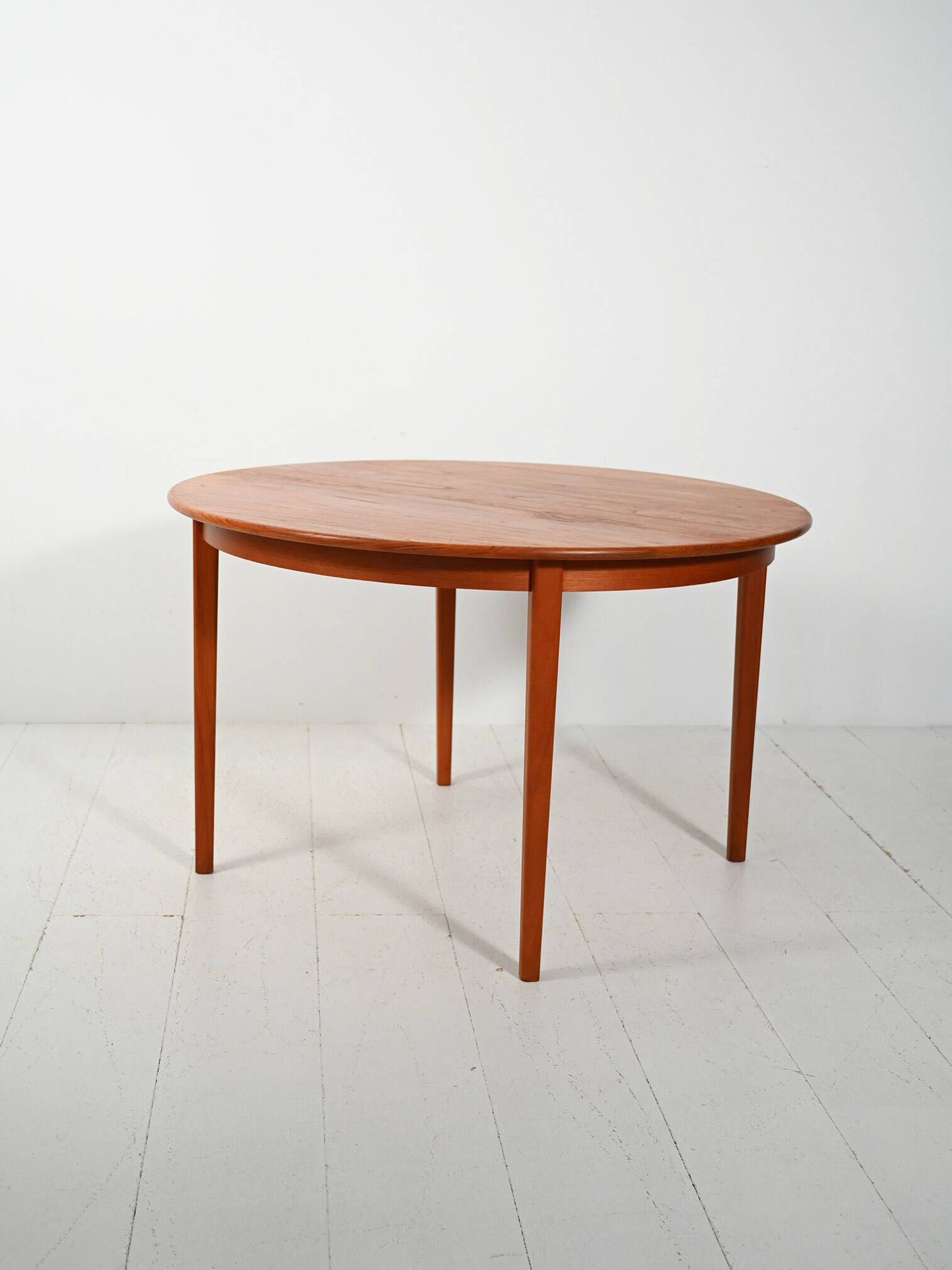 Round extendable teak table by Svante Skogh