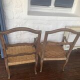 Pair of antique wooden armchairs with woven seats + cushions