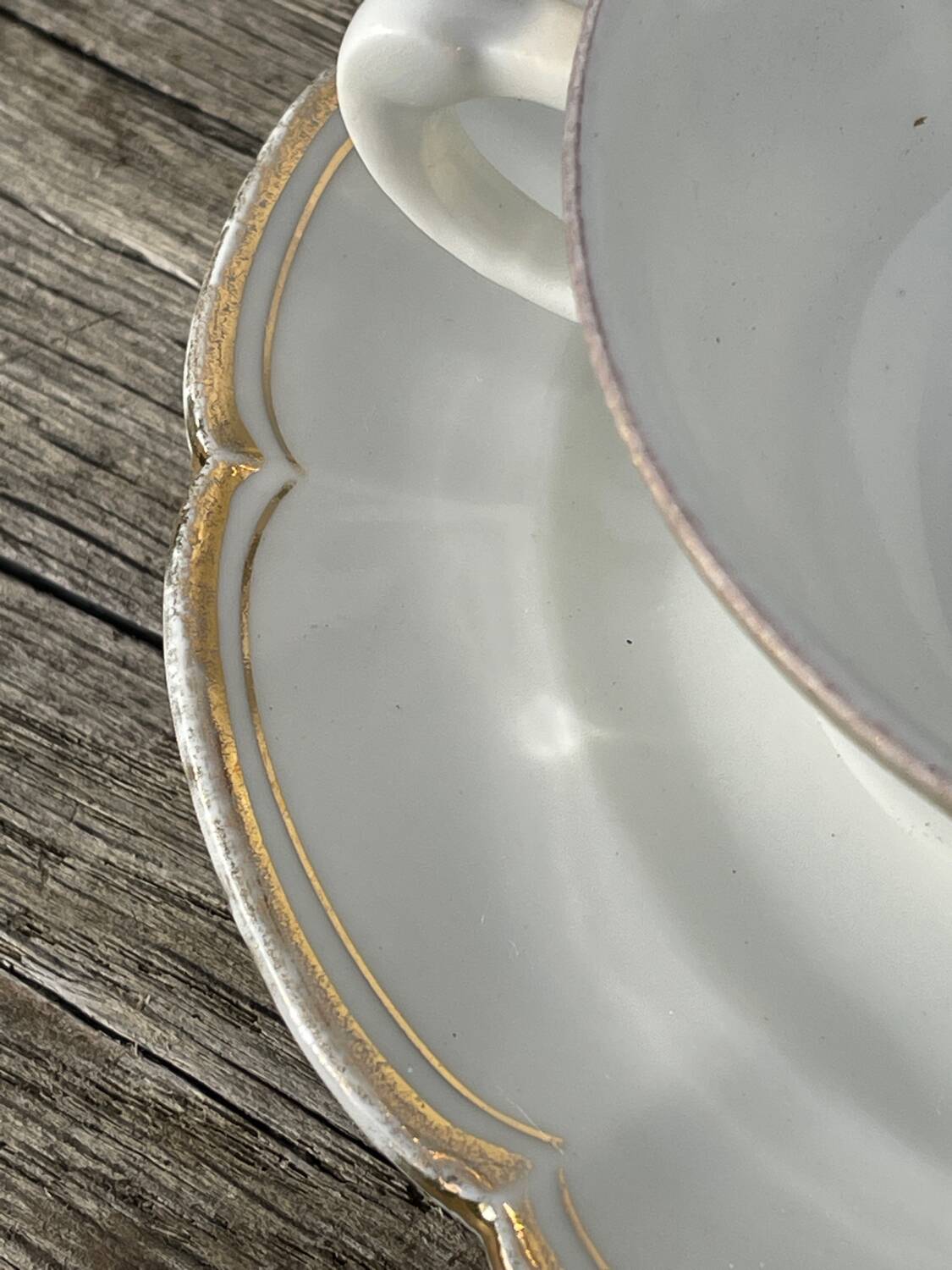 Pair of fine white and gold Limoges porcelain teacups